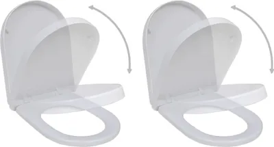 Two white toilet seats with lids shown in an open position, with arrows indicating movement.