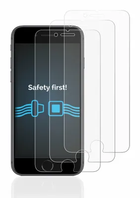 A smartphone with screen protectors laid out in front of it.