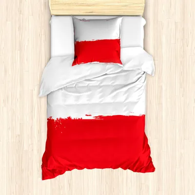 A top-down view of a bed with bedding featuring the Polish flag design.