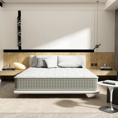 A modern bedroom with a mattress on a bed frame.