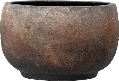 A close-up view of a round, textured planter pot with a dark, earthy color palette.