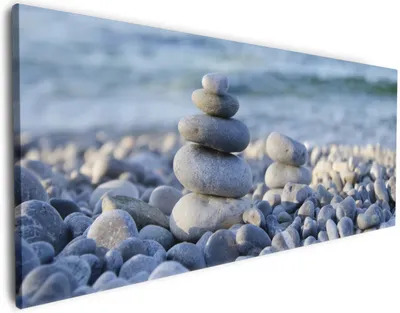 Produktbild von Wallario Premium Leinwandbild Steinstapel am Strand in Größe 60 x 150 cm