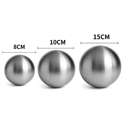 Three stainless steel spheres of different sizes are displayed side-by-side, with measurements indicated above each.