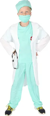 A young boy dressed as a doctor, standing with hands on hips.