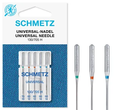 A pack of sewing machine needles and three individual needles shown next to it.
