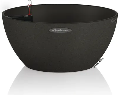 A black planter with a textured finish and a water level indicator is shown against a white background.
