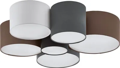 A group of drum-shaped lampshades in different colors.