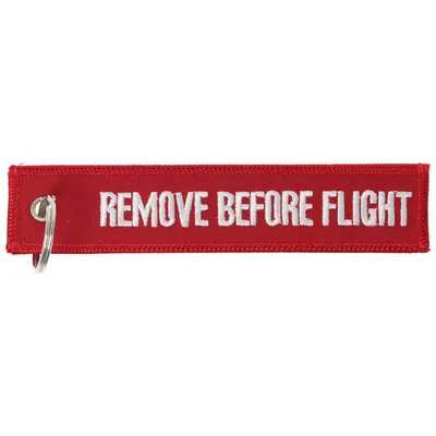 Zdjęcie produktu dla Wisiorek z napisem Remove before flight ok. 13 x 2,8 cm