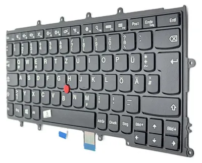 A black keyboard with a red trackpoint, shown from a slightly elevated angle against a white background.