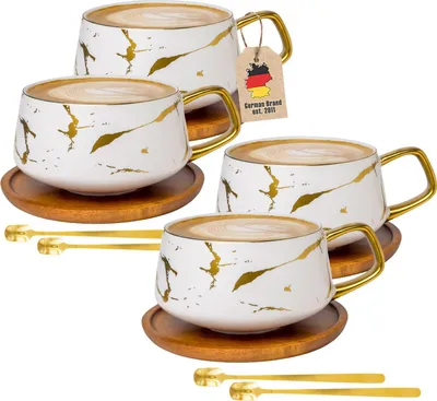 Produktbild von Intirilife 4x Tasse aus Keramik im Marmor Design in Weiß - ca. 200 ml - Kaffeetasse, Teetasse mit Holz Untersetzer Becher, Trinkbecher für Kaffee, Tee, Milch, Kakao und vielem mehr