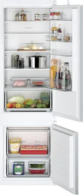 An open refrigerator showing various food items and containers on its shelves.