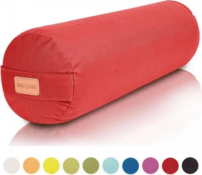 A red yoga bolster is shown in a studio shot with a white background and a reflection.