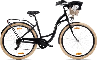 A black city bike with tan tires and a wicker basket on the handlebars, shown against a white background.