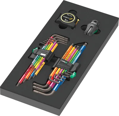 A set of colorful hex keys and a tape measure are neatly arranged in a black foam insert, likely for a tool case.