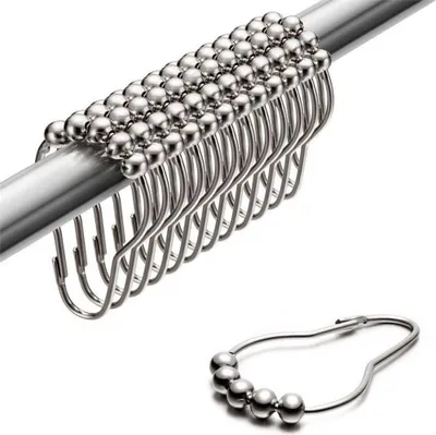 A set of shower curtain rings on a rod, with one ring shown separately.