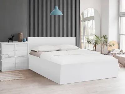 A white bed with two pillows and a white duvet is shown in a bedroom setting. The background features a dark gray wall with vertical slats and a light blue pendant lamp.
