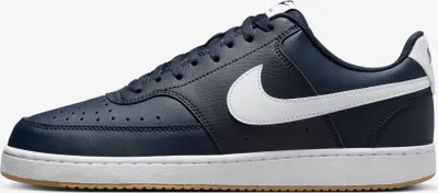 A side view of a single Nike Court Vision Low sneaker.