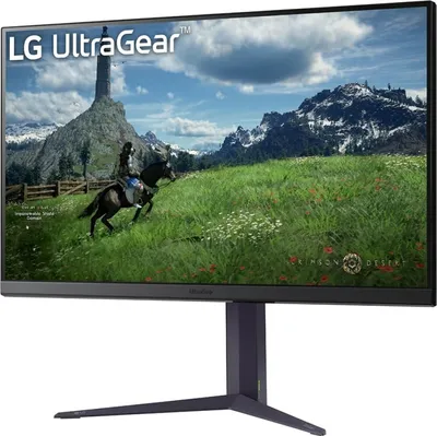 A gaming monitor displaying a fantasy landscape with a rider on a horse.
