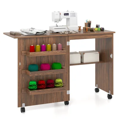 A sewing machine and supplies are neatly organized on a wooden sewing cabinet with shelves and wheels.