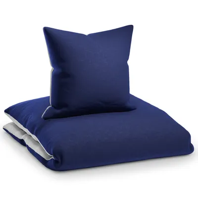 A navy blue duvet cover and pillowcase are neatly folded and stacked on a white background.