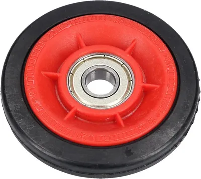A close-up studio shot of a single washing machine drum roller wheel.