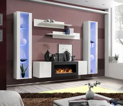 A modern living room with a media console, shelves, and decorative items.