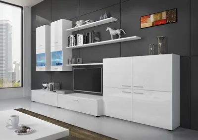 Modern living room furniture display with wall units, a TV stand, and a large cabinet.
