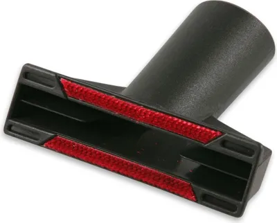 A close-up studio shot of a black vacuum cleaner upholstery nozzle with red bristles.
