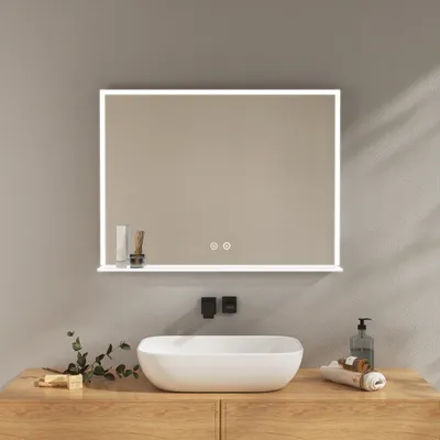 A modern bathroom vanity with a sink and a lighted mirror.