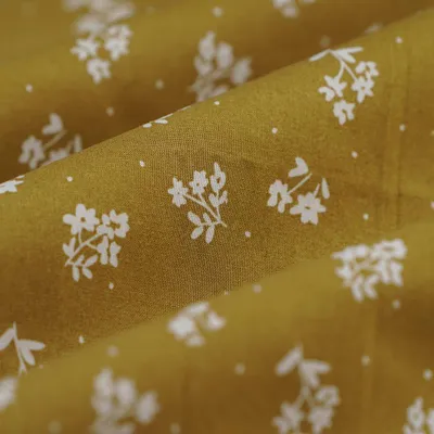 Productafbeelding van Biologisch katoenen popeline met bloemenprint in ecru en brons