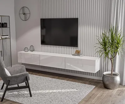 A modern living room with a wall-mounted TV and entertainment unit.