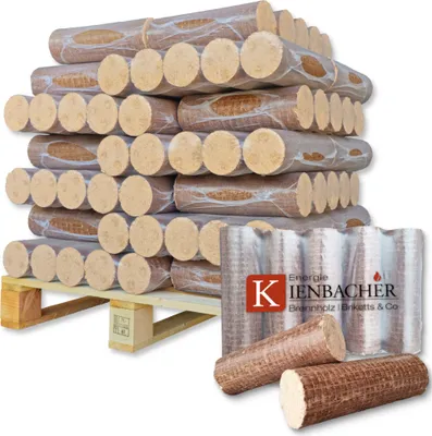 A stack of firewood briquettes on a pallet, with a few briquettes in the foreground.