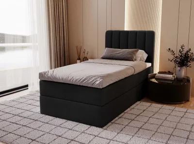A bedroom scene with a bed, nightstand, and rug.