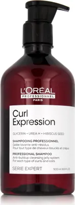 A bottle of L'Oréal Professionnel Curl Expression shampoo against a white background.