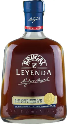 A bottle of Brugal Leyenda rum on a white background.