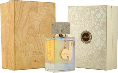 A perfume bottle and its packaging are displayed.