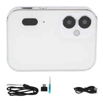A white digital camera with a triple lens system and accessories laid out below it on a white background.