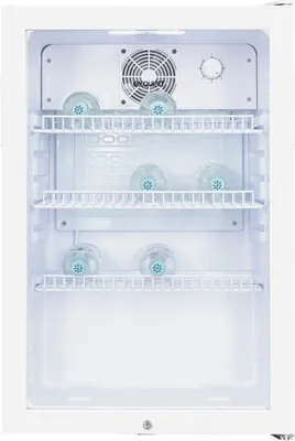 Interior view of a white glass door refrigerator with shelves and several transparent bottles with blue caps.