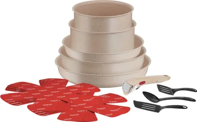 A set of cookware and utensils is displayed against a white background.