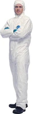 A person wearing a white protective suit with arms crossed.
