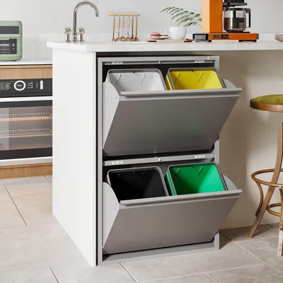 A kitchen island with a built-in trash and recycling system.