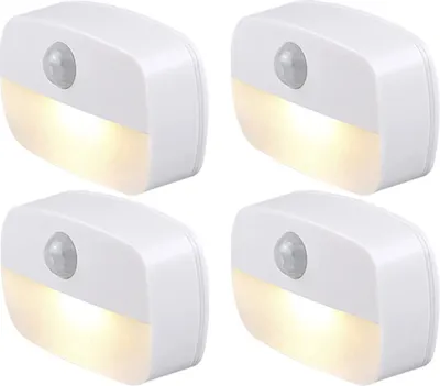 Four white LED night lights with motion sensors are arranged in a 2x2 grid against a white background.