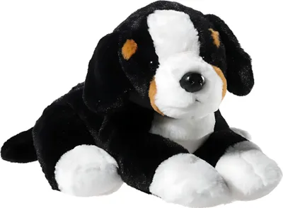 A plush toy dog is shown sitting on a white background.