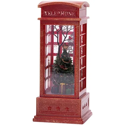 A red telephone booth shaped lantern with a Christmas tree and gifts inside.
