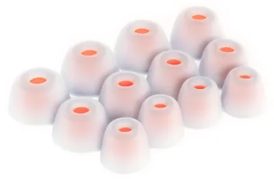 A collection of white silicone ear tips with orange inner cores, arranged in a staggered pattern on a white background.
