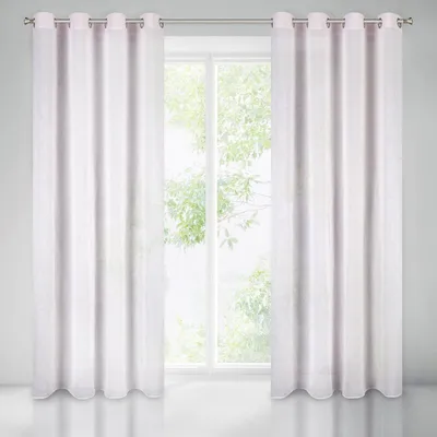 Two white curtains are hung on a rod in front of a window with greenery visible outside.