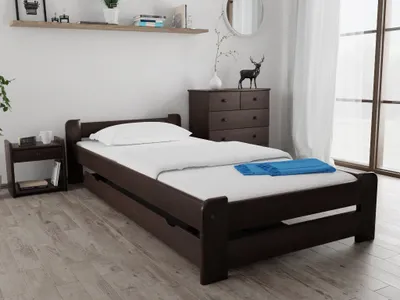 A bedroom scene with a bed, nightstand, and dresser.