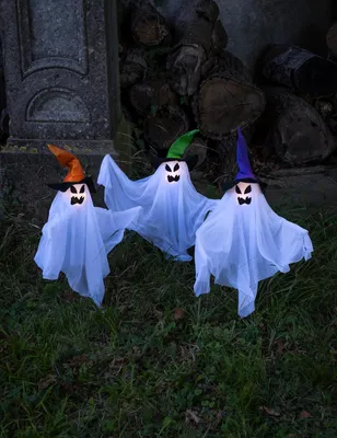 Productafbeelding van Set van drie lichtgevende spookfiguren op stokken - 68 cm -, AI-gegenereerde afbeelding