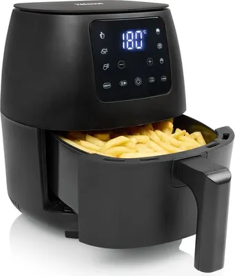 A black air fryer filled with french fries, with its digital display showing '180°C'.