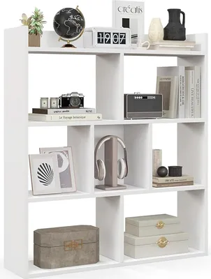 A white cube bookshelf filled with various decorative items.